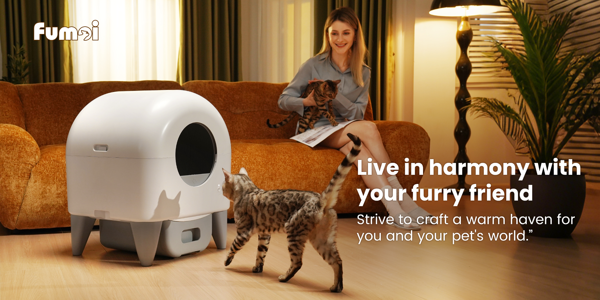 Fumoi M4 self-cleaning cat litter box in a living room with an owner on a couch and a cat, lifestyle hero image with Fumoi branding